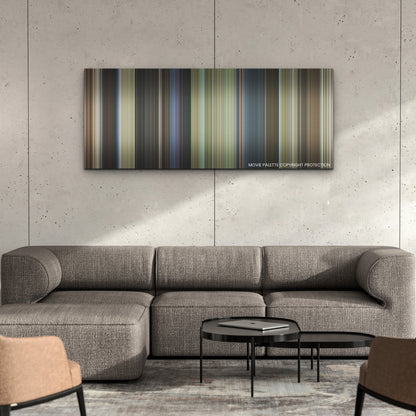 Strays color palette canvas on a concrete wall above a gray sectional sofa