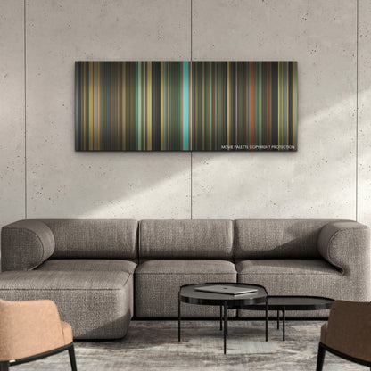 The Iron Claw color palette canvas on a concrete wall above a gray sectional sofa