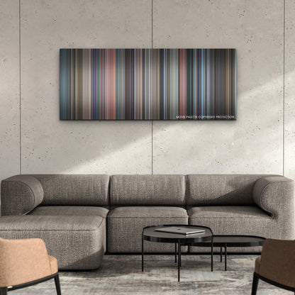 Don't Look Up color palette canvas on a concrete wall above a gray sectional sofa