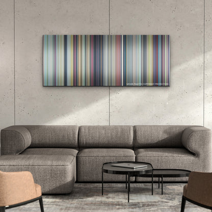 Suzume color palette canvas on a concrete wall above a gray sectional sofa
