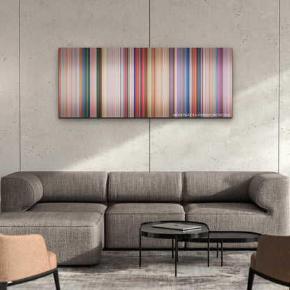 The Super Mario Bros. Movie color palette canvas on a concrete wall above a gray sectional sofa
