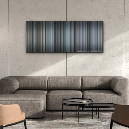 The Ice Road color palette canvas on a concrete wall above a gray sectional sofa