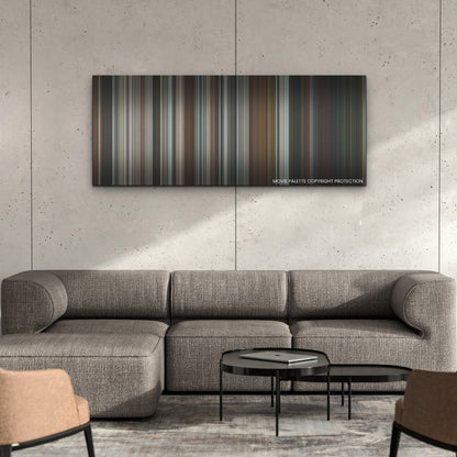 Thanksgiving color palette canvas on a concrete wall above a gray sectional sofa