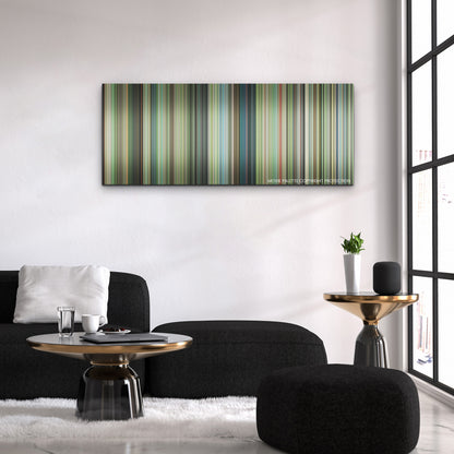 The Boy and the Heron color palette canvas above a black sofa with a gold-topped table