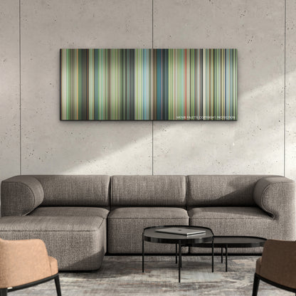 The Boy and the Heron color palette canvas on a concrete wall above a gray sectional sofa