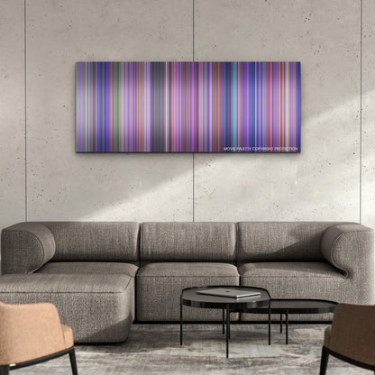 Inside Out 2 color palette canvas on a concrete wall above a gray sectional sofa