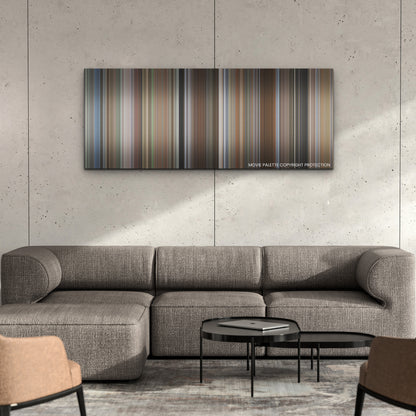 A Family Affair color palette canvas on a concrete wall above a gray sectional sofa