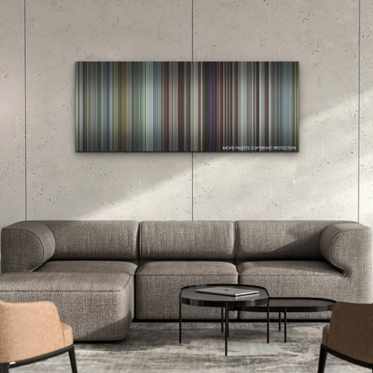 Armor color palette canvas on a concrete wall above a gray sectional sofa