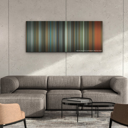 Samaritan color palette canvas on a concrete wall above a gray sectional sofa