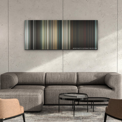 The Ministry of Ungentlemanly Warfare color palette canvas on a concrete wall above a gray sectional sofa