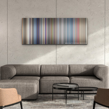 Lift color palette canvas on a concrete wall above a gray sectional sofa