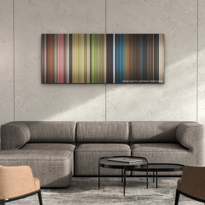 The Lost City color palette canvas on a concrete wall above a gray sectional sofa