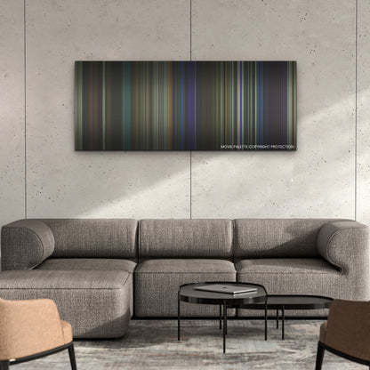 They Cloned Tyrone color palette canvas on a concrete wall above a gray sectional sofa