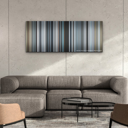 Society of the Snow color palette canvas on a concrete wall above a gray sectional sofa