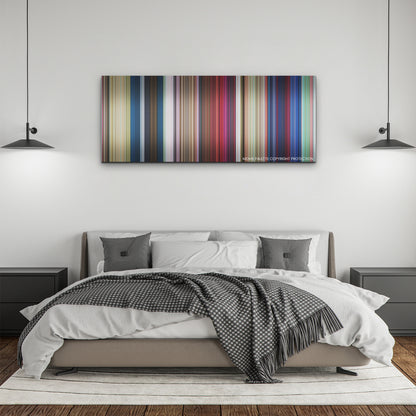 Migration color palette canvas above a bed, between two black pendant lamps