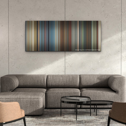 Red Notice color palette canvas on a concrete wall above a gray sectional sofa
