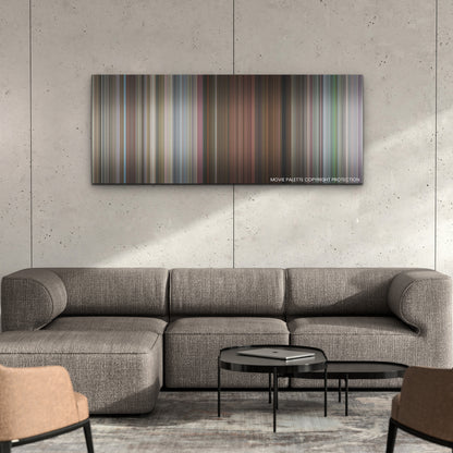 Cinderella color palette canvas on a concrete wall above a gray sectional sofa
