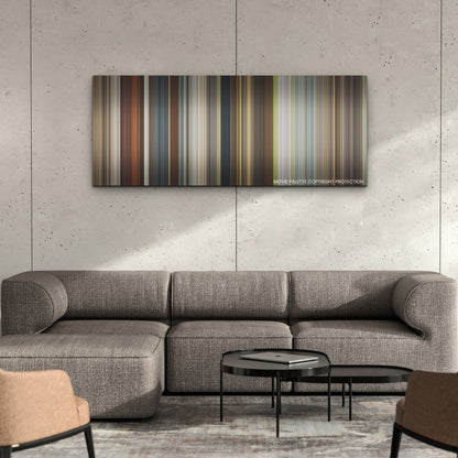 The Harder They Fall color palette canvas on a concrete wall above a gray sectional sofa