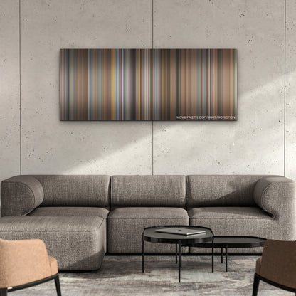 Champions color palette canvas on a concrete wall above a gray sectional sofa