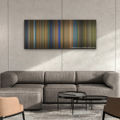 Spiral color palette canvas on a concrete wall above a gray sectional sofa