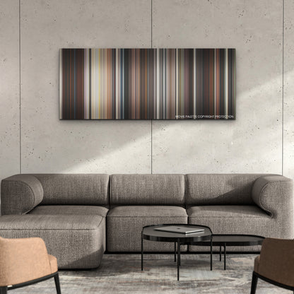 Babylon color palette canvas on a concrete wall above a gray sectional sofa