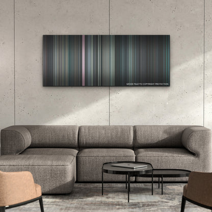 Stowaway color palette canvas on a concrete wall above a gray sectional sofa