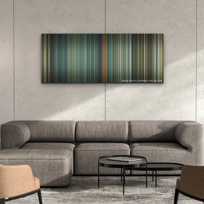 Land of Bad color palette canvas on a concrete wall above a gray sectional sofa