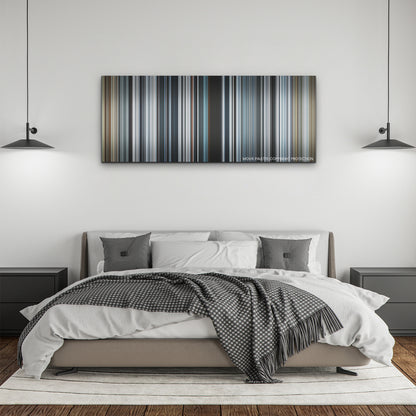 Society of the Snow color palette canvas above a bed, between two black pendant lamps