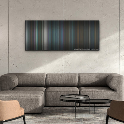Kate color palette canvas on a concrete wall above a gray sectional sofa
