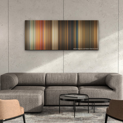 Murder Mystery 2 color palette canvas on a concrete wall above a gray sectional sofa