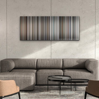 The Tinder Swindler color palette canvas on a concrete wall above a gray sectional sofa
