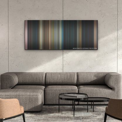 65 color palette canvas on a concrete wall above a gray sectional sofa