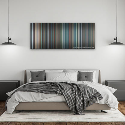 No Time to Die color palette canvas above a bed, between two black pendant lamps