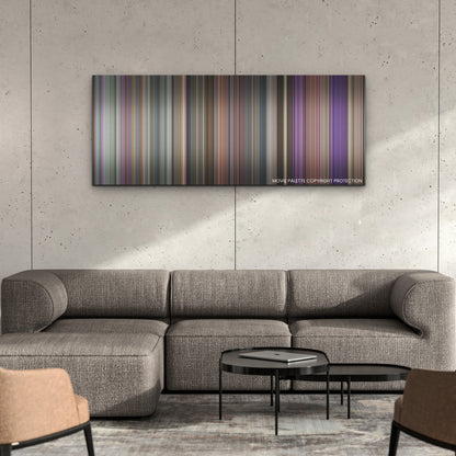 Quiz Lady color palette canvas on a concrete wall above a gray sectional sofa