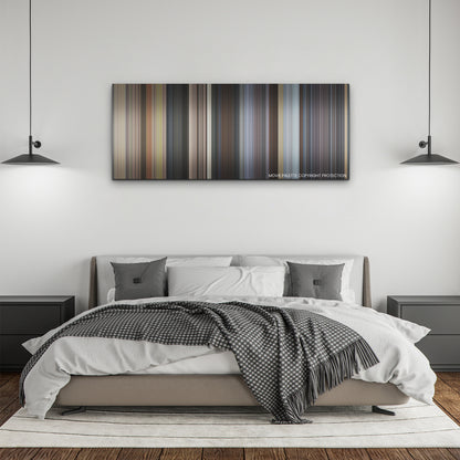 Ghosted color palette canvas above a bed, between two black pendant lamps