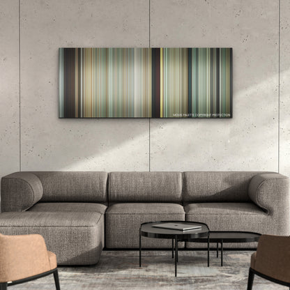 Fall color palette canvas on a concrete wall above a gray sectional sofa