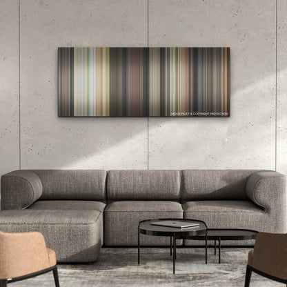 Glass Onion color palette canvas on a concrete wall above a gray sectional sofa