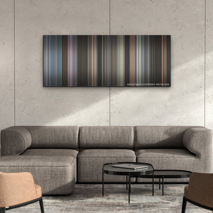 Smile color palette canvas on a concrete wall above a gray sectional sofa