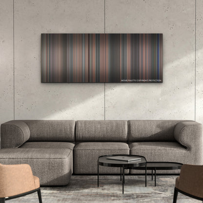 Late Night with the Devil color palette canvas on a concrete wall above a gray sectional sofa