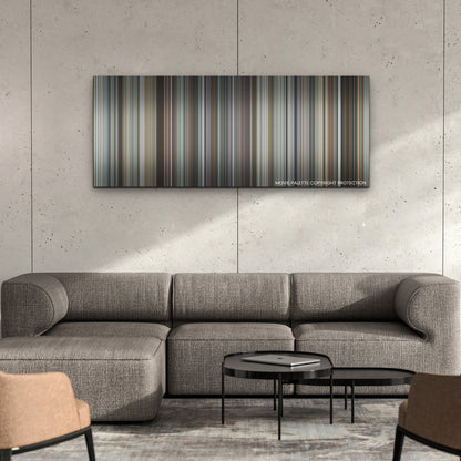 The Unforgivable color palette canvas on a concrete wall above a gray sectional sofa