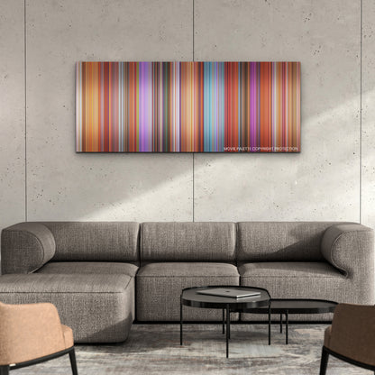 Elemental color palette canvas on a concrete wall above a gray sectional sofa