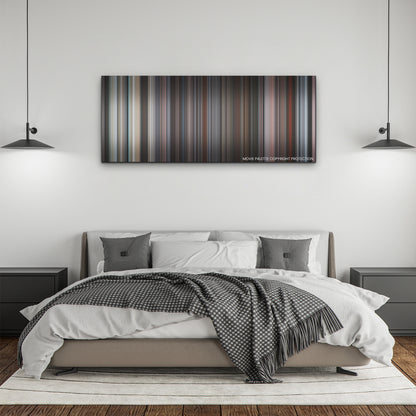 The Lost Daughter color palette canvas above a bed, between two black pendant lamps
