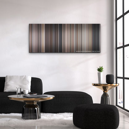 Operation Fortune: Ruse de Guerre color palette canvas above a black sofa with a gold-topped table