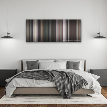 Pearl color palette canvas above a bed, between two black pendant lamps