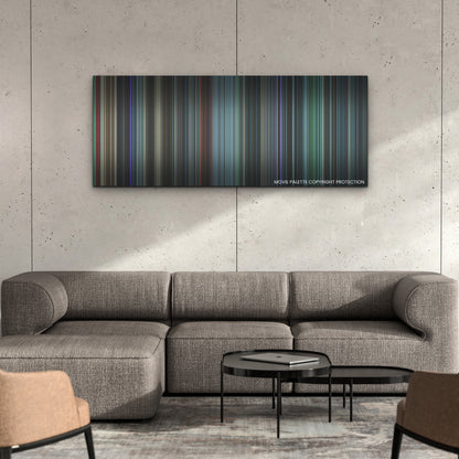 Malignant color palette canvas on a concrete wall above a gray sectional sofa