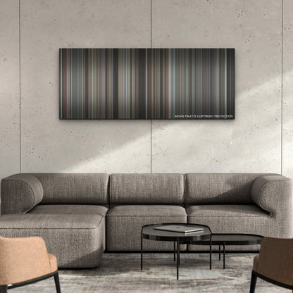 Wrath of Man color palette canvas on a concrete wall above a gray sectional sofa