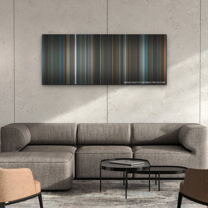 Orphan: First Kill color palette canvas on a concrete wall above a gray sectional sofa