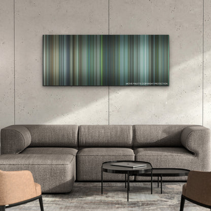 Arthur the King color palette canvas on a concrete wall above a gray sectional sofa