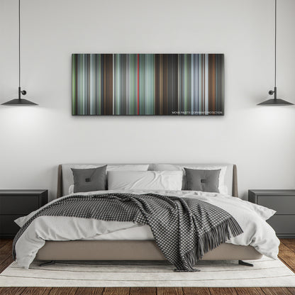 The Zone of Interest color palette canvas above a bed, between two black pendant lamps