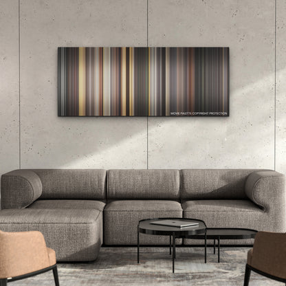 Death on the Nile color palette canvas on a concrete wall above a gray sectional sofa